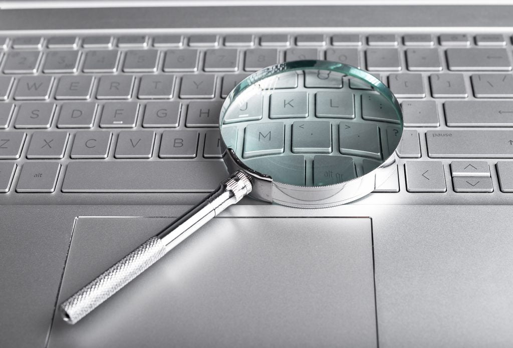 bigstock Magnifying Glass On Laptop Key 453230191