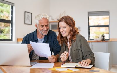 bigstock Mature smiling couple sitting 365289844
